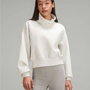 NWOT Lululemon Full Flourish Pullover in Bone, Size 10.